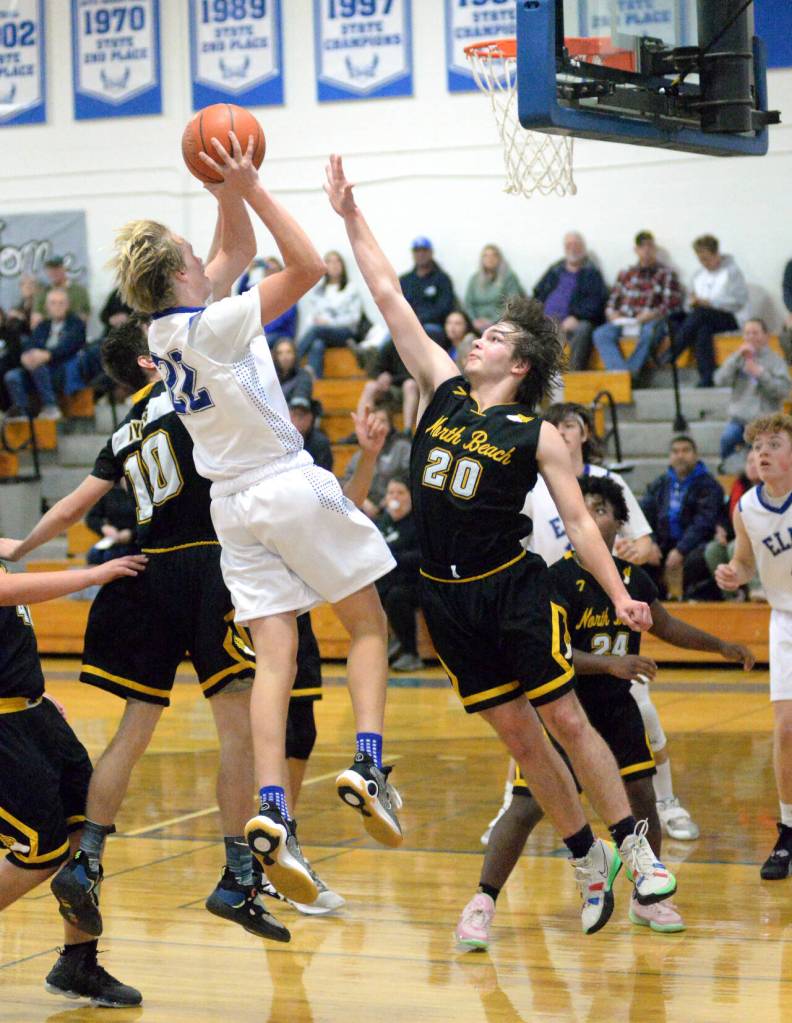 RYAN SPARKS | THE DAILY WORLD Elmas Cason Seaberg (22) rises for a jump shot while North Beachs Kobe Charley (20) defends during the Eagles 65-24 victory on Wednesday, Nov. 30, 2022 at Elma High School.