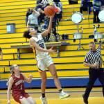 RYAN SPARKS | THE DAILY WORLD Aberdeen senior Maddie Gore (30) scores two of her game-high 25 points in a 45-38 win over Hoquiam on Thursday, Dec. 1, 2022 at Sam Benn Gym in Aberdeen. Hoquiam guard Graci Bonney-Spradlin (1) looks on.