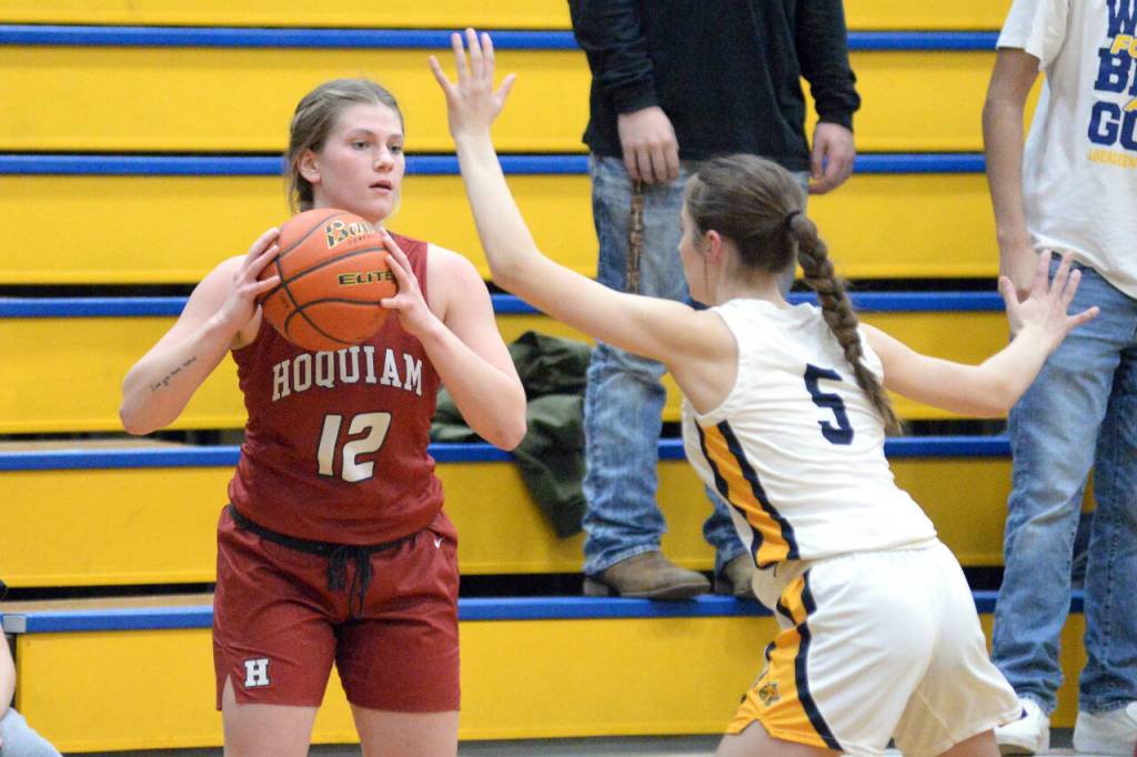 RYAN SPARKS | THE DAILY WORLD Hoquiam senior Ashlinn Cady (12) looks to inbound the ball while defended by Aberdeens Mija Hood (5) during the Grizzlies 45-38 loss on Thursday, Dec. 1, 2022 at Sam Benn Gym in Aberdeen.