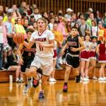 PHOTO BY FOREST WORGUM Hoquiams Zander Jump runs away from Ocosta defenders during the Grizzlies 69-35 victory on Friday at Hoquiam Square Garden in Hoquiam.