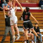 PHOTO BY FOREST WORGUM Hoquiams Michael Lorton Watkins (12) puts up a shot over Ocostas Kevin Agramon during the Grizzlies 69-35 victory on Friday in Hoquiam. Lorton Watkins led all scorers with 22 points.