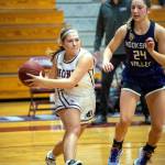 PHOTO BY FOREST WORGUM Montesanos Jordan Karr, left, looks to pass while being defended by Nooksack Valleys Devin Coppinger (24) during the Bulldogs 73-46 loss on Saturday in Montesano.