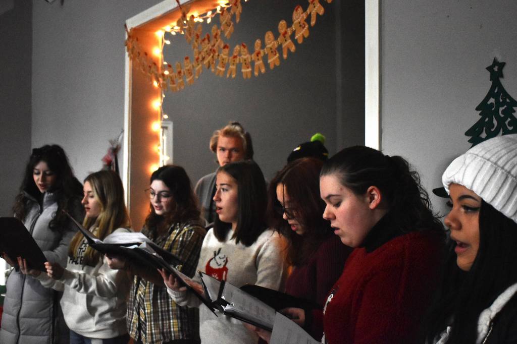 Clayton Franke / The Daily World
The Goldenaires, a local high school a cappella group, provide a Christmas serenade for those perusing Saturdays gingerbread house display in the Go Get the Pho restaurant building.