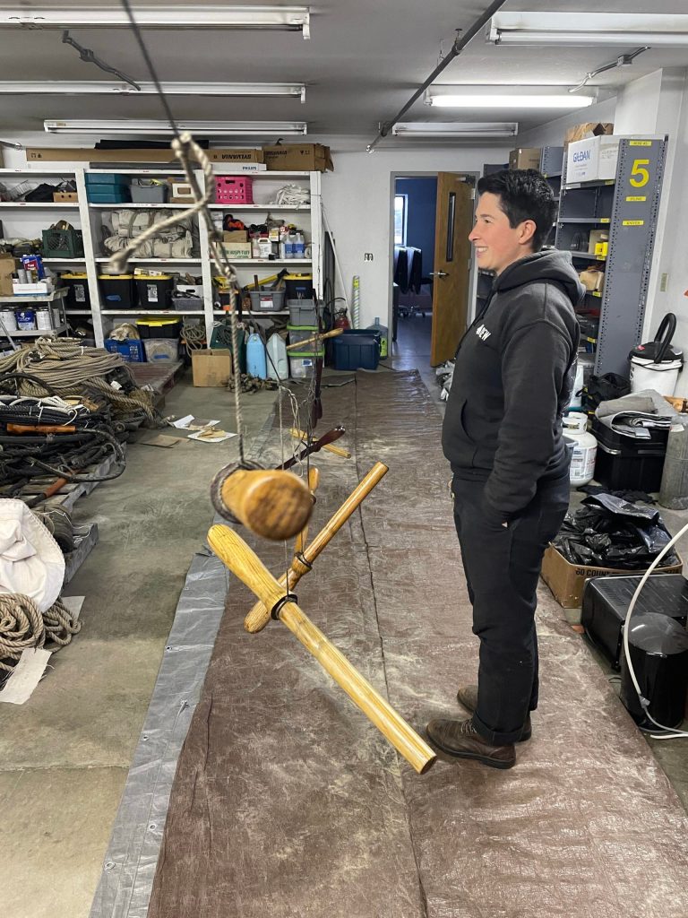 Michael S. Lockett / The Daily World 
Captain Katherine Pogue of the Lady Washington looks on to the vessels maintenance space where the vessels necessaries are being prepared for another season at sea.