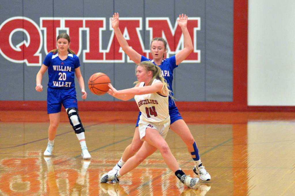RYAN SPARKS | THE DAILY WORLD Hoquiam guard Ella Folkers (14) passes the ball while being defended by Willapa Valleys Lauren Matlock during the Grizzlies 50-32 win on Wednesday in Hoquiam.