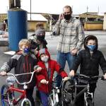 In a past year, the Delimonts  Joseph, 8, Eliot, 6, and Jarom, 9, show off their new bikes they got from Bicycles from Heaven, with their parents Kina and David (from left.)