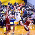 RYAN SPARKS | THE DAILY WORLD Aberdeens Baylor Ainsworth (23) looks to pass while Hoquiams Zander Jump (11) and Joey Bozich defend during the Grizzlies 66-47 win on Monday at Sam Benn Gym in Aberdeen.