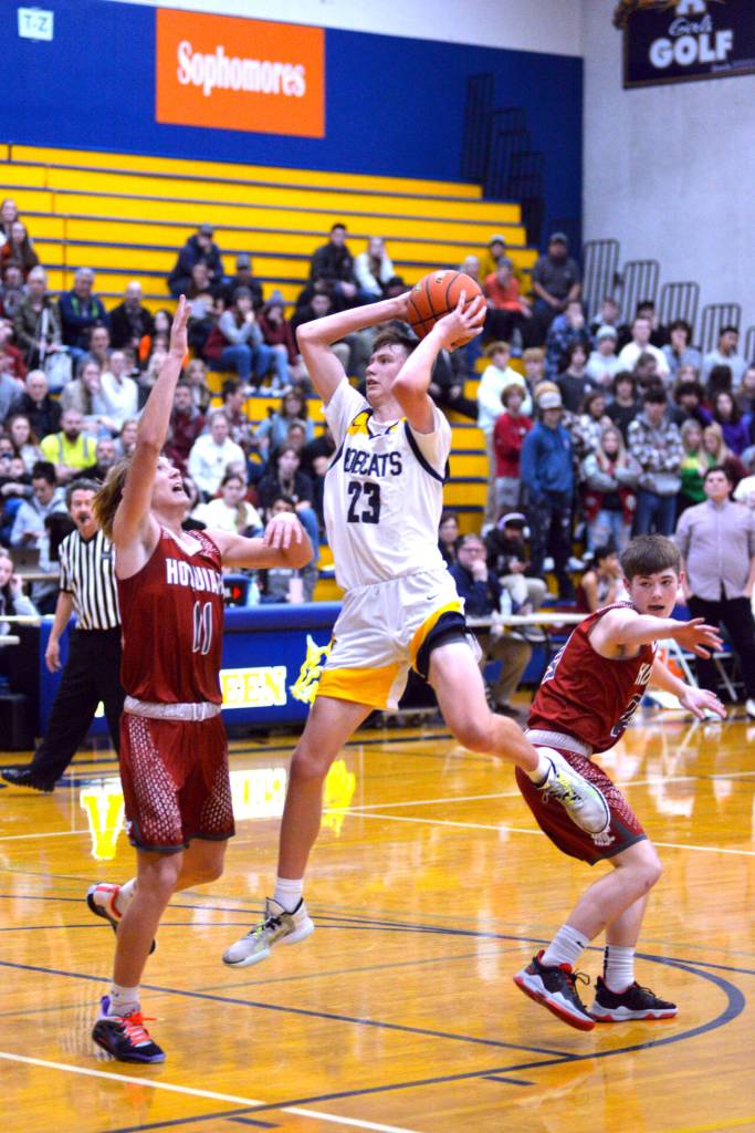 RYAN SPARKS | THE DAILY WORLD Aberdeens Baylor Ainsworth (23) looks to pass while Hoquiams Zander Jump (11) and Joey Bozich defend during the Grizzlies 66-47 win on Monday at Sam Benn Gym in Aberdeen.