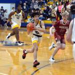 RYAN SPARKS | THE DAILY WORLD Aberdeen guard Issac Garcia (15) drives while shadowed by Hoquiams Michael Lorton Watkins during the Grizzlies 66-47 win on Monday at Sam Benn Gym in Aberdeen.