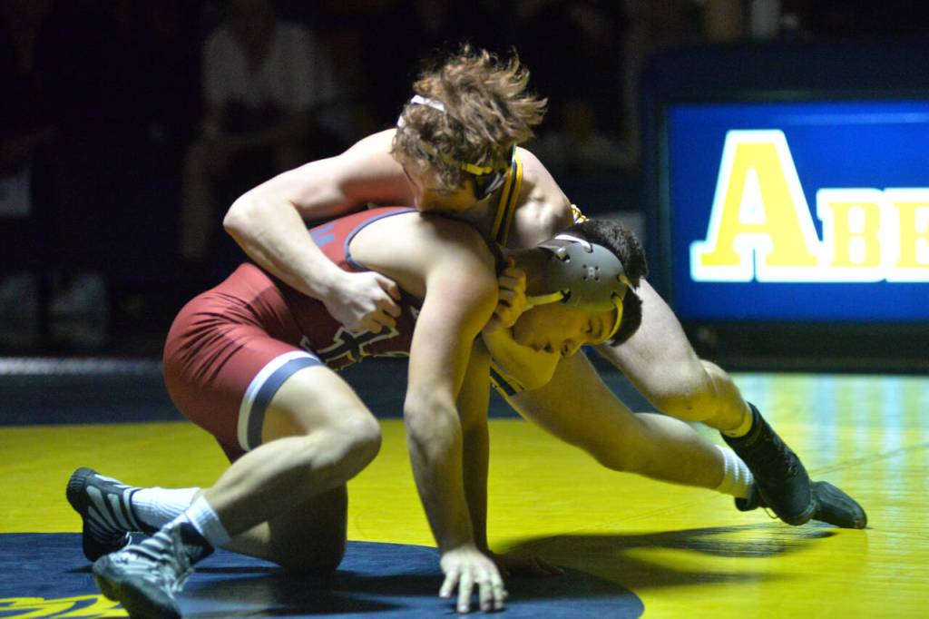 RYAN SPARKS / THE DAILY WORLD Aberdeen junior Michael Leontyev, top, drives into Hoquiam sophomore Brannon Gonzalez during the 145-pound match of the Bobcats 63-18 dual-meet victory on Tuesday in Aberdeen.