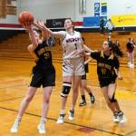 PHOTO BY VAN ADAM DAVIS Ocostas Alexandria Matthews (1) competes for a rebound against North Beachs Kayla Easman (41) and Malia Cox during the Wildcats 36-29 win on Wednesday in Westport.