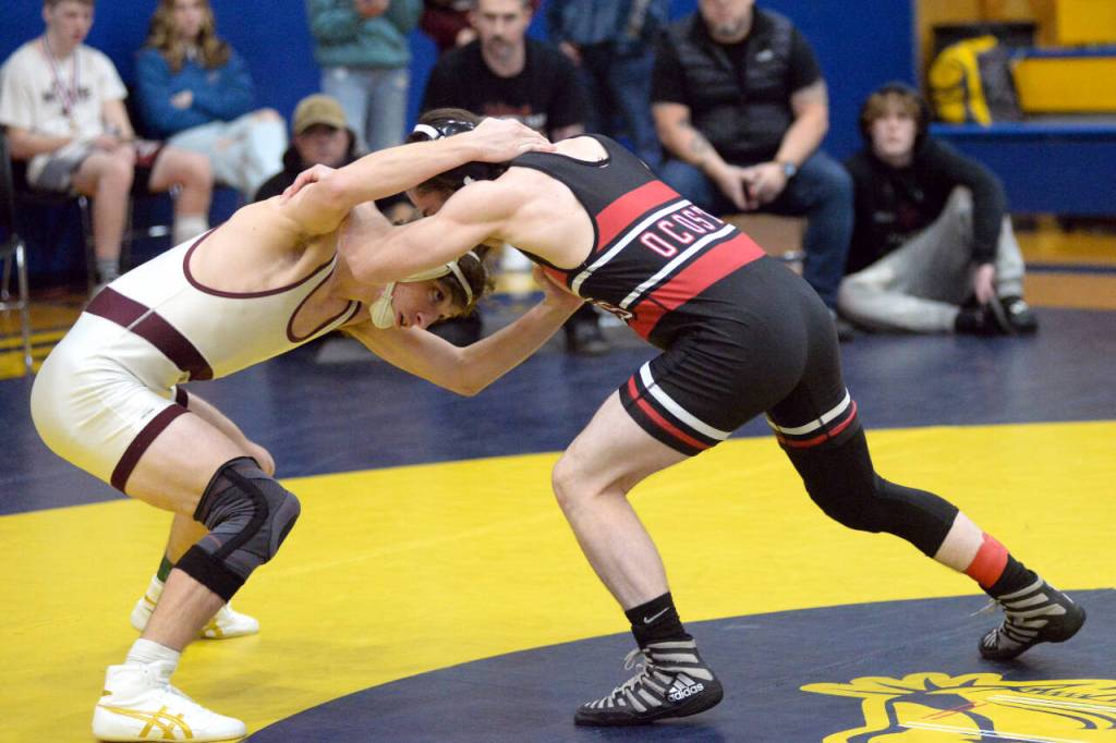 RYAN SPARKS | THE DAILY WORLD Montesanos Cole Ekerson, left, squares off against Ocostas Aiden Davis during the 138-pound final of the Grays Harbor Championships on Saturday at Sam Benn Gym in Aberdeen.