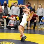 RYAN SPARKS | THE DAILY WORLD North Beachs Wyeland Lomedico, background, grapples with Hoquiams Kingston Case in the 126-pound final of the Grays Harbor Championships on Saturday at Sam Benn Gym in Aberdeen.