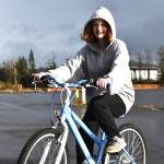 Matthew N. Wells / The Daily World 
Riley Gilbert, 14, received her first Christmas gift  a new bike  Saturday. Riley, who hasnt had a new bike in a couple of years, rode her North Carolina Tar Heel-painted bike around as she and her mom, Kim, smiled. The bike is courtesy of the Aberdeen Lions Clubs program Bicycles from Heaven, which, after a simple application through the Salvation Army, provides children and teenagers bikes. Riley cant wait to show hers off to her friends.