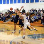 RYAN SPARKS | THE DAILY WORLD Elmas Grant Vessey, right, collides with Aberdeens Kyle Miller (4) and Trey Anderson while going for a loose ball during the second half of the Eagles 65-38 victory on Tuesday in Elma.