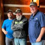 Mike McNeley, center, poses with fellow soldiers and Gulf War veterans Troy Callihan, left, and Robert Mills, right, as McNeley rode across the country, raising money and awareness for veterans mental healthcare in late 2022. (Courtesy photo / Mike McNeley)