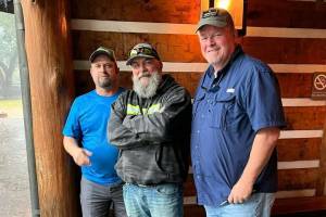Mike McNeley, center, poses with fellow soldiers and Gulf War veterans Troy Callihan, left, and Robert Mills, right, as McNeley rode across the country, raising money and awareness for veterans mental healthcare in late 2022. (Courtesy photo / Mike McNeley)