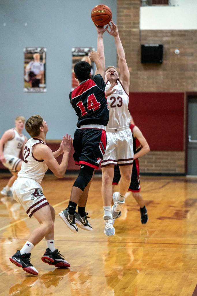 PHOTO BY FOREST WORGOM Montesano senior Tyce Peterson (23) deflects a pass by Raymond guard Chris Quintana during the Seagulls 60-47 victory on Wednesday at Montesano High School. Peterson led all scorers with 27 points.