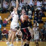 RYAN SPARKS | THE DAILY WORLD Raymonds Talon Yearout scores on a drive and windmill layup while Montesanos Gabe Bodwell (10) defends during the Seagulls 60-47 victory on Wednesday at Montesano High School. Yearout was one of three Seagulls to score in double figures in the game.