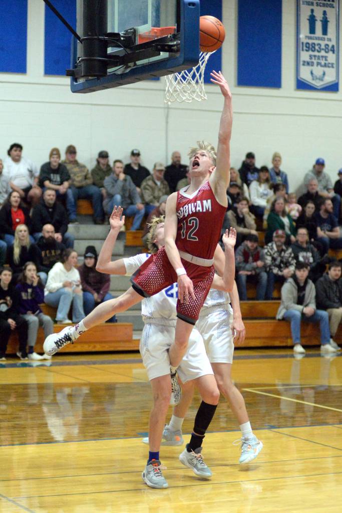 RYAN SPARKS | THE DAILY WORLD Hoquiam guard Michael Lorton Watkins (12) scores on a breakaway layup during the Grizzlies 63-53 loss to Elma on Wednesday at Elma High School.