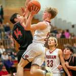 PHOTO BY FOREST WORGUM Hoquiam guard Michael Lorton Watkins glides to the hoop while being defended by Teninos Brody Noonan (14) during the Grizzlies 62-47 loss on Friday in Hoquiam.