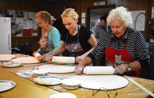 Matthew N. Wells / The Daily World
Janie Valentine, Andrea Krause and Barbara Jorgenson, from left, work up some sweat equity as they lovingly flatten lefse  a product of potato, flour, water, milk and butter  in preparation for the Sons of Norway Grays Harbor dinner on Sunday afternoon, Jan. 15, at the nonprofit organizations building at 717 Randall St. in Aberdeen. The three women were part of a group of about 20 people on Tuesday who were making the Norwegian flatbread.