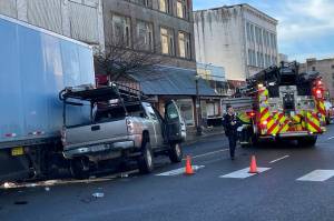 Michael S. Lockett / The Daily World
A semi-truck running a red light struck a pickup truck in downtown Aberdeen on the morning of Wednesday, Jan. 11. The driver of the semi was cited for failure to yield.
