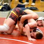 PHOTO BY SUE MICHALAK BUDSBERG Aberdeens Tyler Caskey, top, controls Cle Elums Colin OCain during Caskeys 11-7 victory in the 120-pound final of the Grizzly Alumni Invitational on Saturday in Hoquiam.