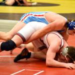PHOTO BY SUE MICHALAK BUDSBERG Elmas Austin Salazar, top, grapples with Hoquiams Anthony Burtenshaw during the 195-pound final of the Grizzly Invitational on Saturday in Hoquiam. Salazar won the title with a 12-5 decision.