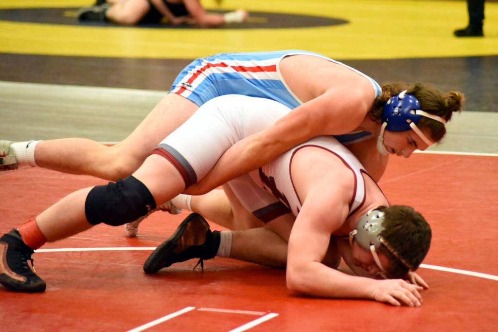 PHOTO BY SUE MICHALAK BUDSBERG Elmas Austin Salazar, top, grapples with Hoquiams Anthony Burtenshaw during the 195-pound final of the Grizzly Invitational on Saturday in Hoquiam. Salazar won the title with a 12-5 decision.