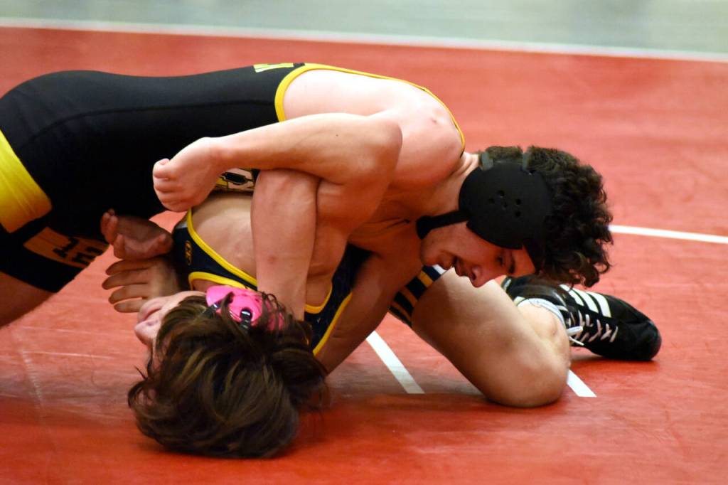 PHOTO BY SUE MICHALAK BUDSBERG North Beachs Wyeland Lomedico, top, grapples with Aberdeens Rique Gadwa in the 126-pound final of the Grizzly Alumni Invitational on Saturday in Hoquiam. Lomedico won via a 9-2 decision.