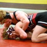 PHOTO BY SUE MICHALAK BUDSBERG Ocostas Andrew Martin, bottom, and Willapa Harbors Carson Borden compete in the 145-pound championship match of the Grizzly Alumni Invitational on Saturday in Hoquiam. Martin won via 9-6 decision.