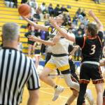 RYAN SPARKS / THE DAILY WORLD 
Aberdeens Baylor Ainsworth, left, scores two of his 10 first-half points in the Bobcats 50-49 win over Centralia on Tuesday in Aberdeen.