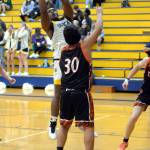 RYAN SPARKS / THE DAILY WORLD 
Aberdeen center Jabron Brooks, left, grabs a rebound over Centralias Carlos Vallejo (30) during the Bobcats 50-49 win on Tuesday at Sam Benn Gym in Aberdeen.
