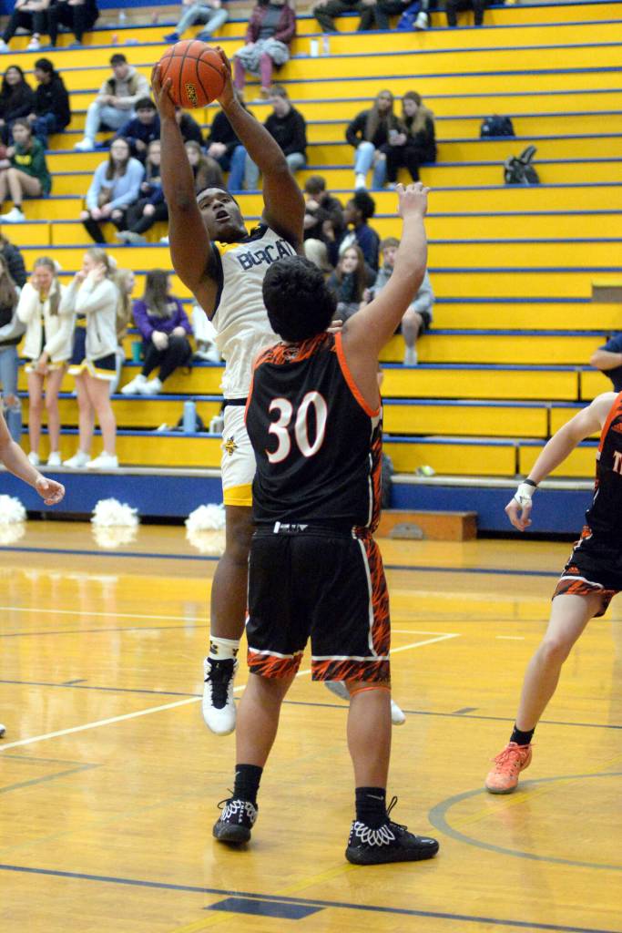 RYAN SPARKS / THE DAILY WORLD 
Aberdeen center Jabron Brooks, left, grabs a rebound over Centralias Carlos Vallejo (30) during the Bobcats 50-49 win on Tuesday at Sam Benn Gym in Aberdeen.