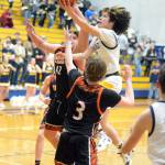 RYAN SPARKS / THE DAILY WORLD
Aberdeens Manny Garcia glides to the basket against Centralias Cohen Ballard (3) during the Bobcats 50-49 win on Tuesday at Sam Benn Gym in Aberdeen.