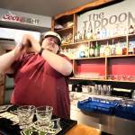 Bryce Romero, proprietor of The Tap Room  103 East Wishkah St., in Aberdeen  shakes a couple of drinks Tuesday early afternoon for thirsty customers. Romero often uses those skills to make the Green Tea shot, and hand-crafted cocktails. While Romero isnt sure where the Jameson-based drink came from, he said his place is in the running for the best one in town. (Matthew N. Wells / The Daily World)
