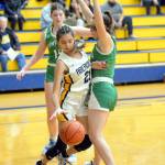 RYAN SPARKS | THE DAILY WORLD Aberdeen junior Jaylynn Phimmasone (21) looks to dribble around Tumwaters Morgan Simmons during the Bobcats 65-32 loss on Friday at Sam Benn Gym in Aberdeen.