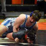 PHOTO BY SUE MICHALAK BUDSBERG Elmas Aiden McCain, top, controls Toledos Chase Meyers during the Rubber Chicken meet on Saturday in Kalama.