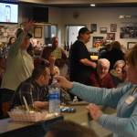 Arguably the main appeal of the Baked Potato Feed and Dollar Auction fundraiser for the Grays Harbor Timberwolves on Saturday, Jan 21, in Aberdeen, came from the unique lottery-style live auction. Beth Torseth (light blue shirt) led the auction and gave bidders their numbers depending on how many dollars they were willing to give. (Allen Leister / The Daily World)
