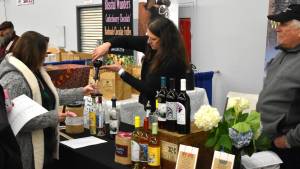 Allen Leister / The Daily World 
Over 20 wine tasting vendors from notable wineries in Western and Eastern Washington were present at the 14th annual Elma Winter Wine Festival on Saturday, Jan. 21. Guests were given samples of a variety of different wine blends thoughout the venue.