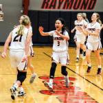 PHOTO BY LARRY BALE Raymonds Megan Kongbouakhay (3) celebrates with teammate Kassie Koski (21) after the Seagulls defeated Forks 64-41 on Tuesday in Raymond.