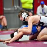 JIM THRALL | MATFOCUS.COM Montesanos Cole Ekerson, top, competes during a 1A Evergreen duals meet on Saturday in Montesano. Ekerson passed 100 wins for his prep career during the event.