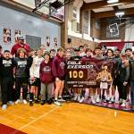 JIM THRALL | MATFOCUS.COM Montesano wrestlers and coaches pose for a photo after sweeping four matches after a 1A Evergreen duals meet on Saturday in Montesano.