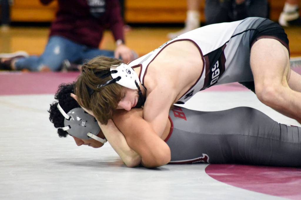 PHOTO BY SUE MICHALAK BUDSBERG Montesanos Cole Ekerson, top, defeated Hoquiams Santiago Martinez via pinfall to earn the 100th victory in his prep career on Saturday at Montesano High School.