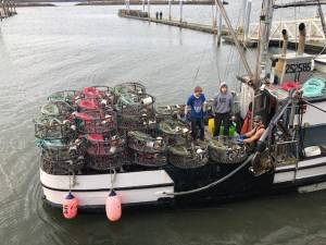 Michael Wagar / The Daily World 
The Southern Cross out of the Tokeland marina is loaded up with pots and ready to head out to Willapa Bay on Dump Day. Master deckhand Jeremy Hammond is at right.