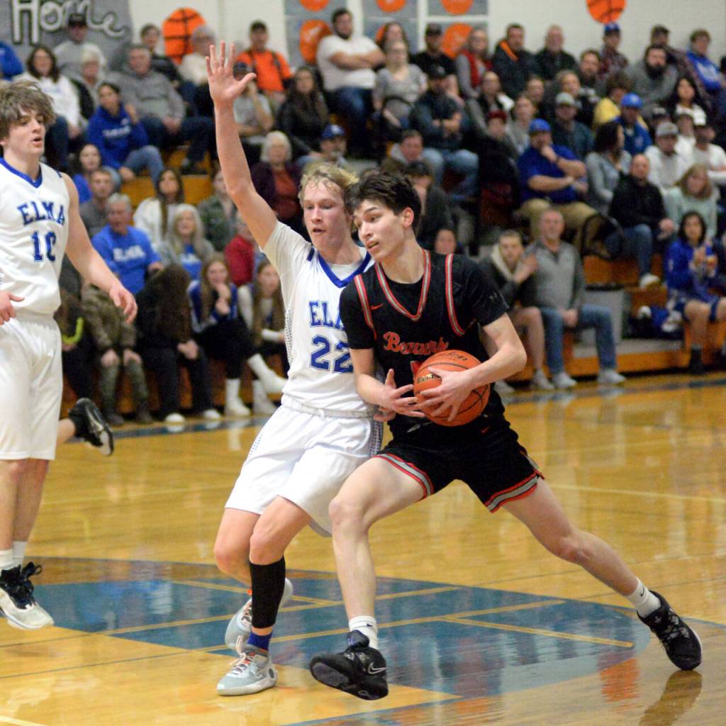 RYAN SPARKS | THE DAILY WORLD Elma junior Cason Seaberg (22) defends Tenino sophomore Noah Schow during the Eagles 62-39 victory on Tuesday at Elma High School.