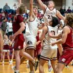 PHOTO BY FOREST WORGUM Montesanos Tyce Peterson (23) and Soren Cobb defend against Hoquiams Michael Lorton Watkins, left, during the Grizzlies 54-28 win on Thursday in Montesano.