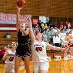 PHOTO BY FOREST WORGUM Montesanos Mikayla Stanfield (10) shoots against Hoquiams Sydney Gordon (44) during the Bulldogs 65-31 win on Friday in Hoquiam.