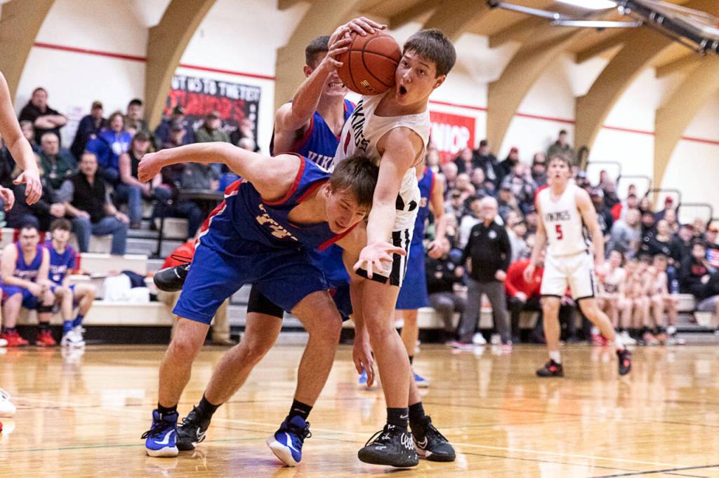ALEC DIETZ | THE CHRONICLE Mossyrock guard Keegan Kolb looks to an official for a foul call after getting tangled up with Willapa Valleys Derek Fluke during Valleys 51-49 win on Friday at Mossyrock High School.